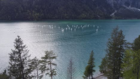 many little boats on lake achen in tyrol