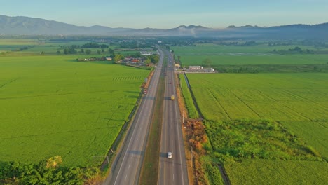 above view of cars across duarte highway at bonao with mountains in background, dominican republic. aerial shot