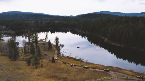 suv's convoy beside a lake