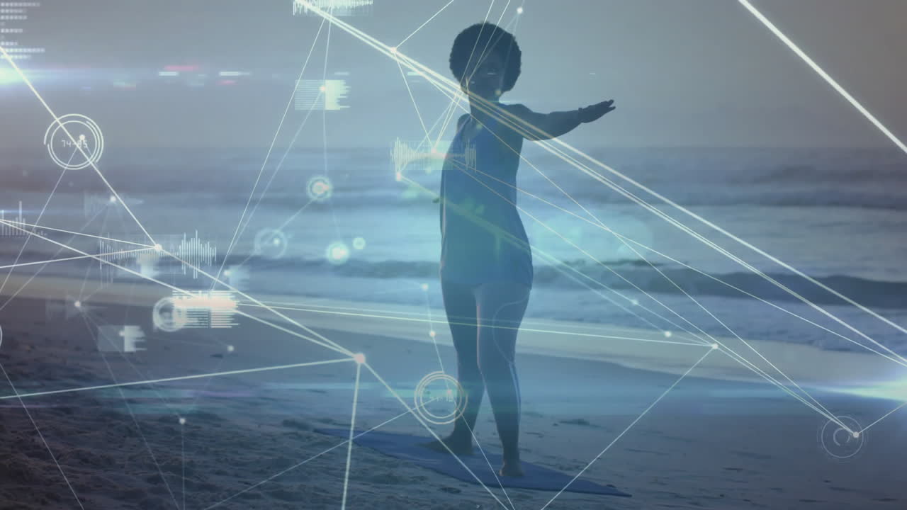 Practicing yoga on beach, child with digital animation and network lines overlay