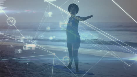 practicing yoga on beach, child with digital animation and network lines overlay