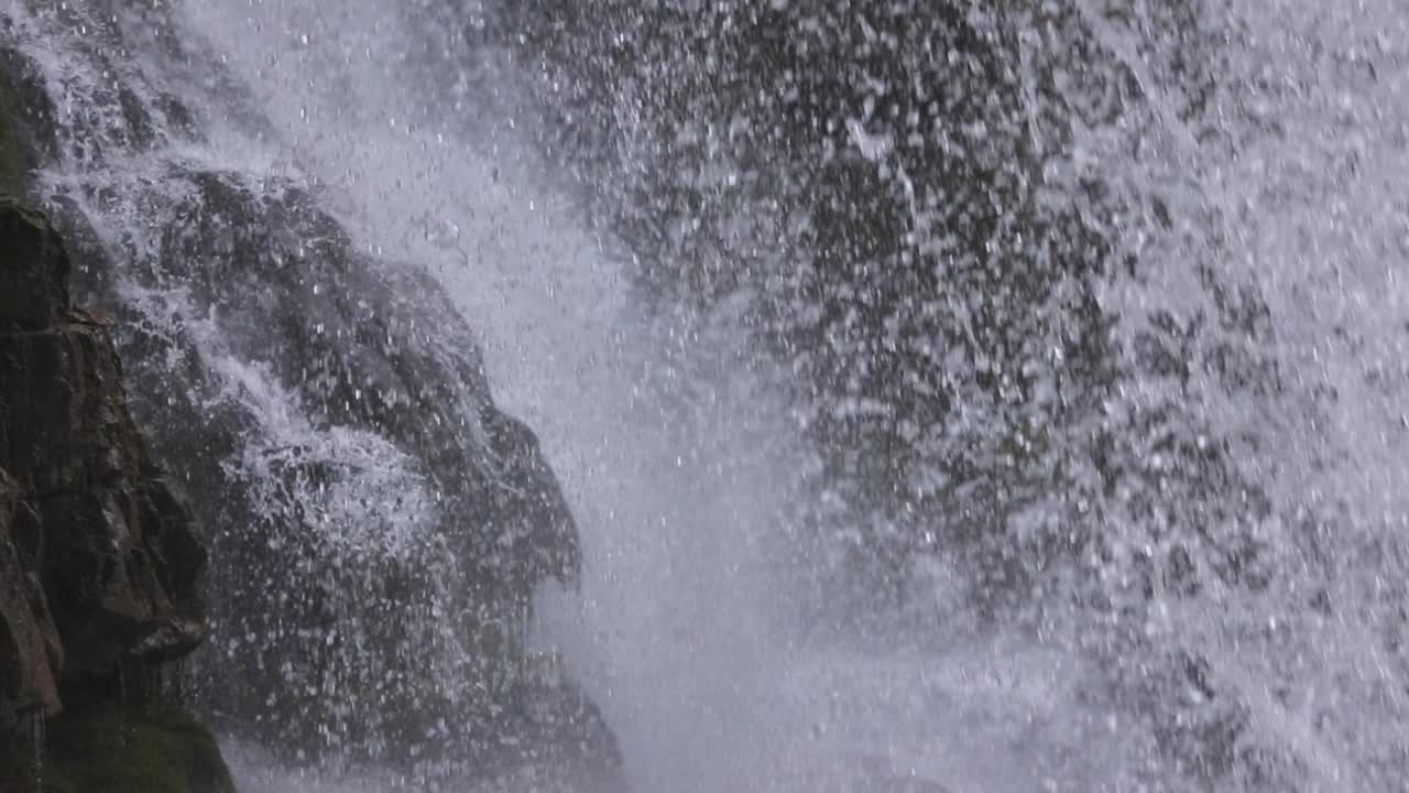 Closeup of drops on Waterfall of Vallesinella and landscape, Madonna di Campiglio, Trentino Alto Adige, Italy