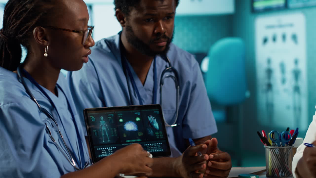 Healthcare professionals discussing patient health records during a meeting