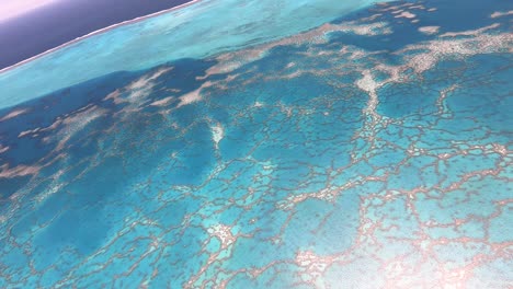 Aerial-flight-over-New-Caledonia-barrier-reef,-the-longest-reef-in-the-world