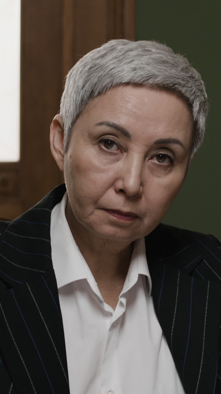 Older Business Woman Reading Documents