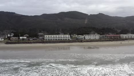 buildings on beach of oregon coast. aerial sideways