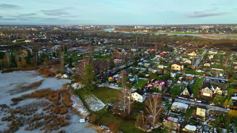 beautiful rural village in early winter on sunny day, aerial drone view