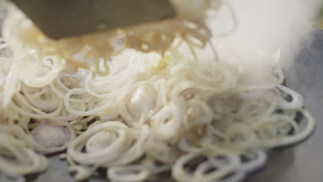 cooking sliced onions