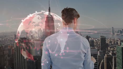 animation of caucasian businessman touching virtual screen and globe over cityscape