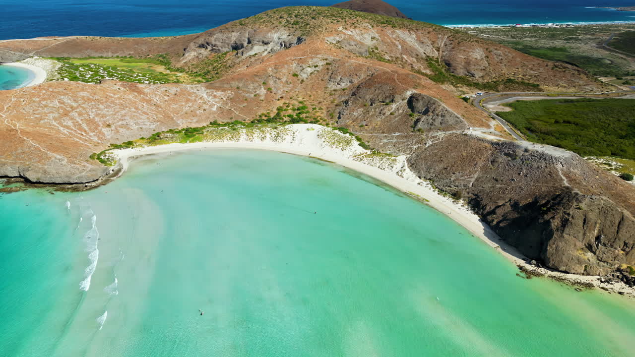 Aerial drone view of the iconic Balandra Bay with its turquoise lagoon, white sand beaches, and rocky desert surroundings in Baja California Sur, Mexico