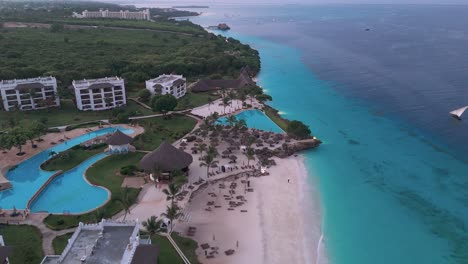 stunning aerial view of a beach resort in nungwi, zanzibar, with turquoise water
