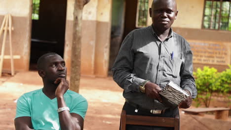 portrait of two african men outdoors giving a speech. closeup shot.