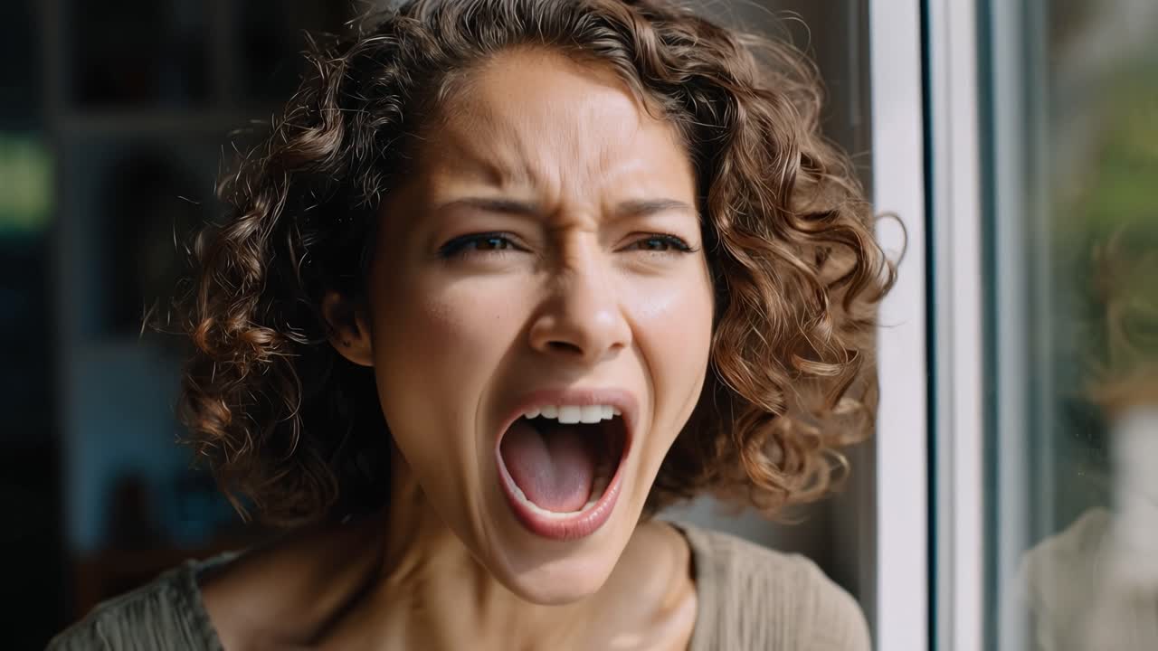 A Woman's Emotional Journey: From Anger to Contemplation in Two Powerful Moments Captured in a Thought-Provoking Video Sequence