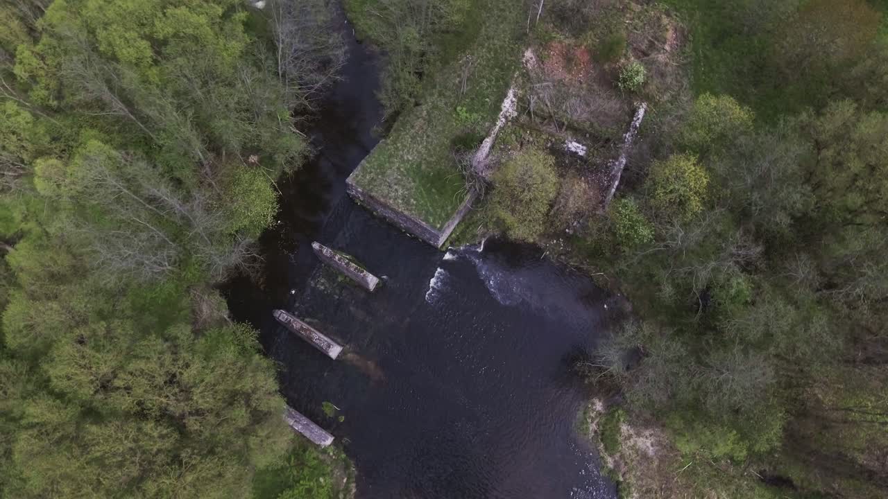 Remains of the collapsed Musninkai (Musninkėliai) Manor Homestead Water Mill. 4K aerial Circle Truck Right