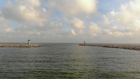 Lighthouses-in-the-end-of-jetties-in-a-cloudy-day-make-the-entance-of-a-bay