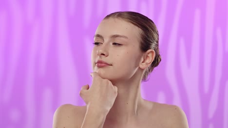 young woman practicing skincare with gentle facial touching a young woman with natural makeup gently touches her face promoting healthy skincare practices slow motion