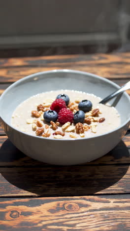 warm oatmeal with blueberries, raspberries, and walnuts