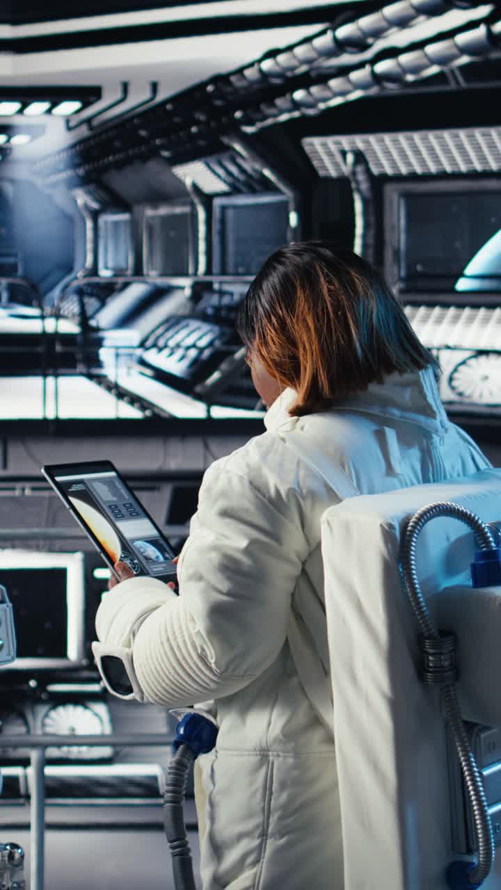 Vertical video Cheerful astronaut holding helmet doing human expansion in space