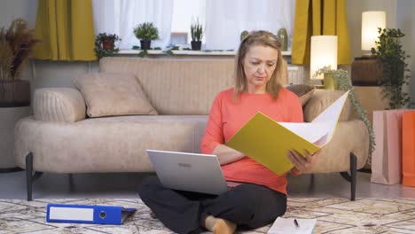 The-woman-looking-at-the-documents-is-thoughtful.