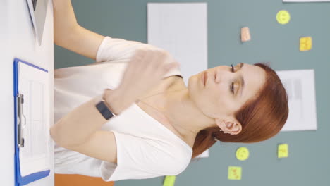 vertical video of the woman who fell asleep in front of a laptop.