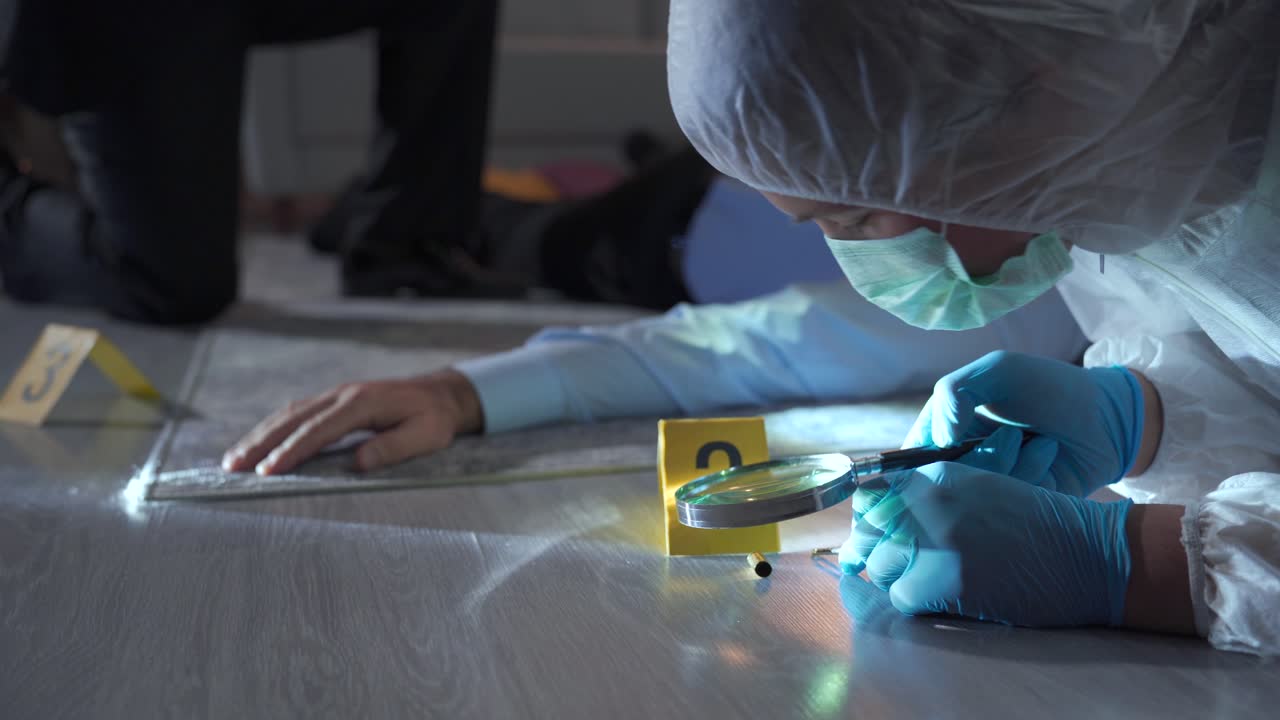 Forensic criminologist man and detective working at the crime scene.