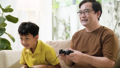 asian man and boy in the living room