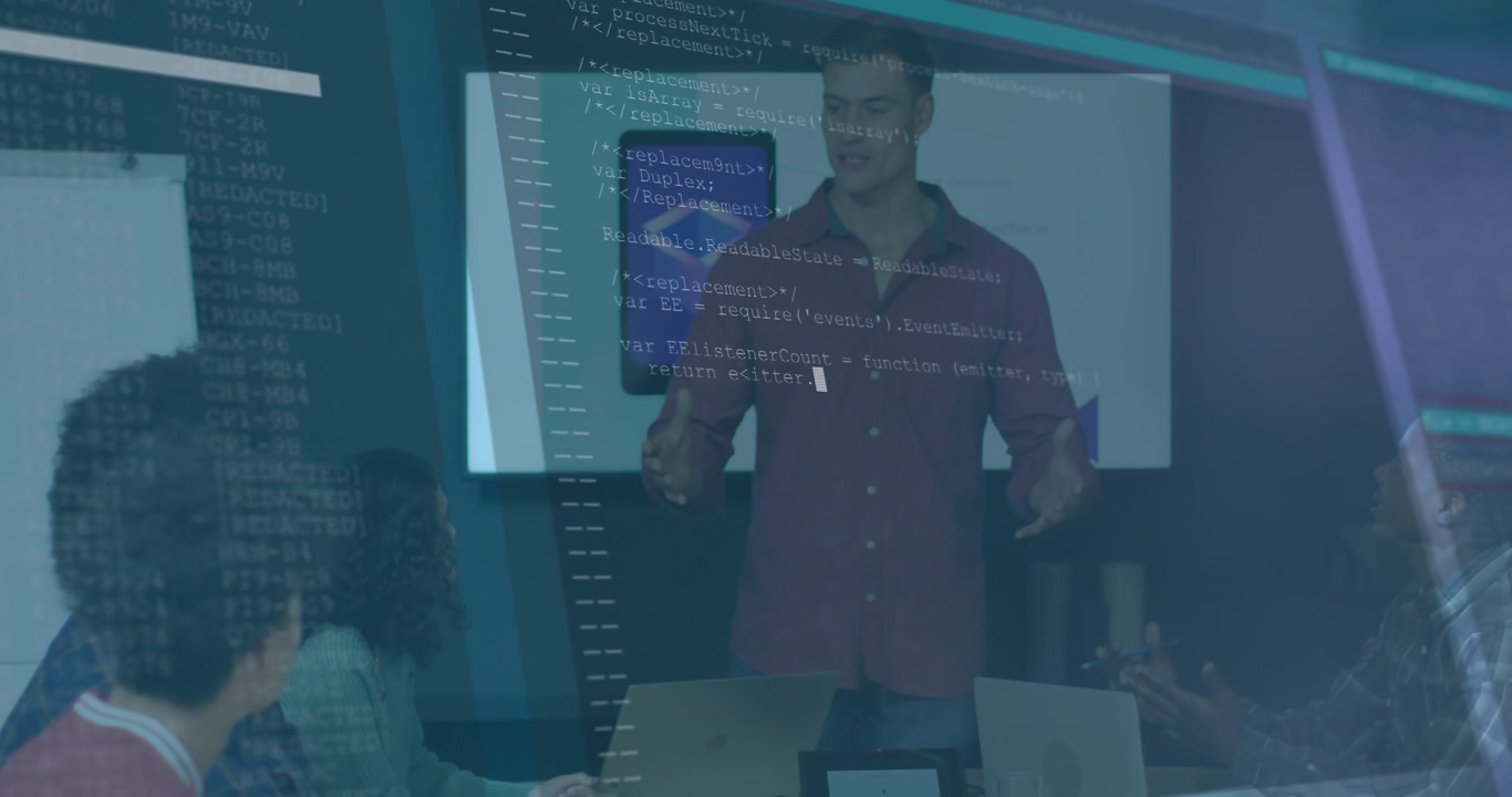 Male presenter standing and showing software in meeting, UI overlaying while team noting laptops