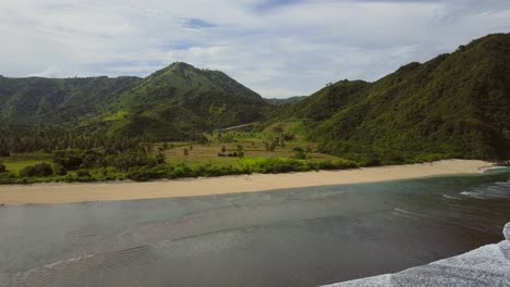 A-remote-surf-beach-at-Pantai-Selong-Belanak,-Lombok,-Aerial-shots-during-day-light