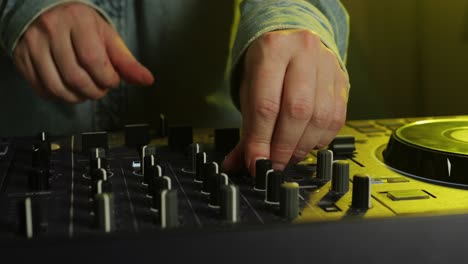 dj performing on a controller