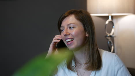 A-happy-shocked-and-surprised-young-woman-receiving-good-news-and-congratulating-a-friend-talking-in-the-phone