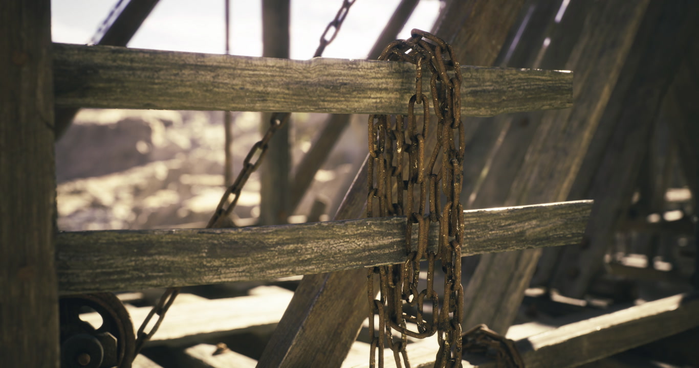 Rusty chains on weathered beams in an abandoned rocky area