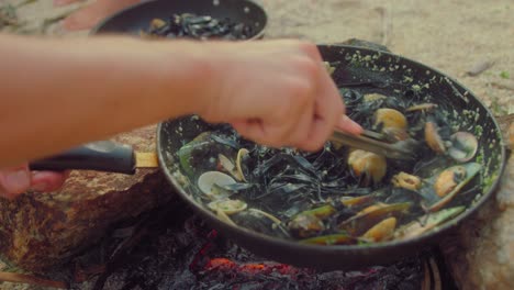 cooking seafood pasta by the campfire