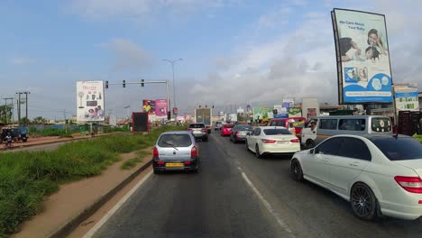 timelapse of moving traffic on road in accra, ghana - africa