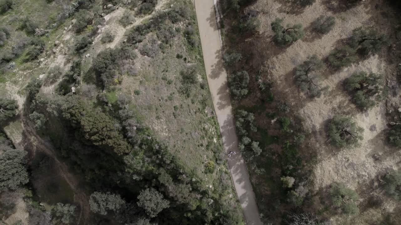 Top-down 4K aerial view of Olvera, Spain, filmed with a DJI drone at 30fps. A stunning cinematic shot capturing the vast meadows and natural beauty of the Spanish countryside.