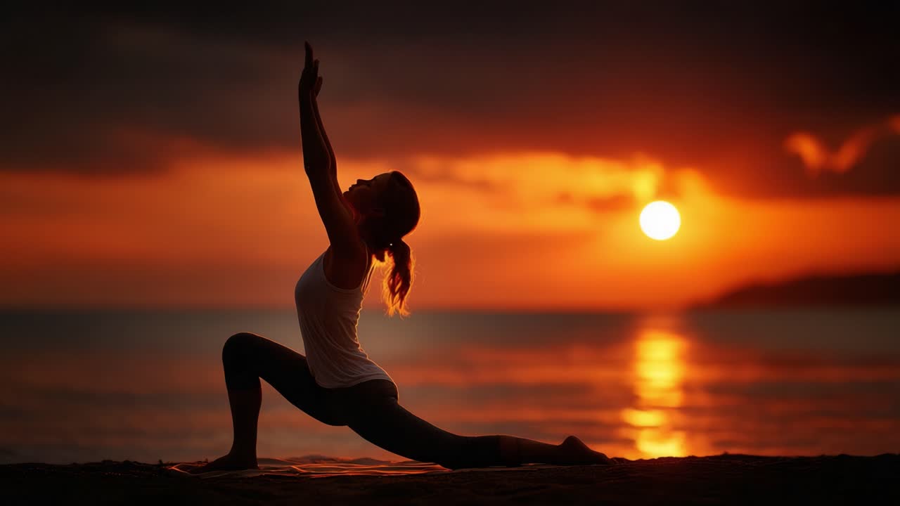 Silhouette of a Yoga Practitioner in a Graceful Pose Against a Stunning Sunset Over the Ocean, Capturing the Serenity and Beauty of Mindfulness and Nature