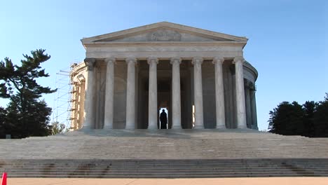 a statue of thomas jefferson is seen standing inside the jefferson memorial building