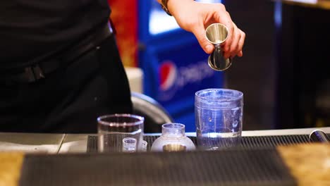 bartender skillfully prepares cocktails at a bar