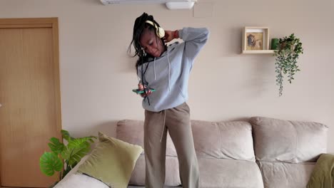 woman dancing to music at home