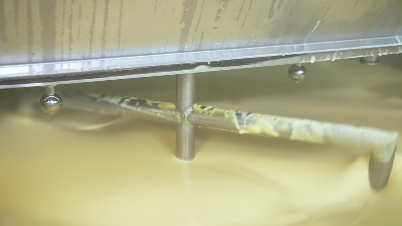 Butter production line at dairy industry. Close up view of butter production at dairy plant