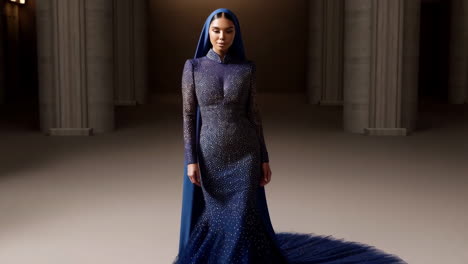 elegant woman in a royal blue embellished gown