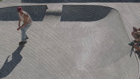 skaters riding skateboard inside concrete bowl, integrating animated speed graphs for sports ads