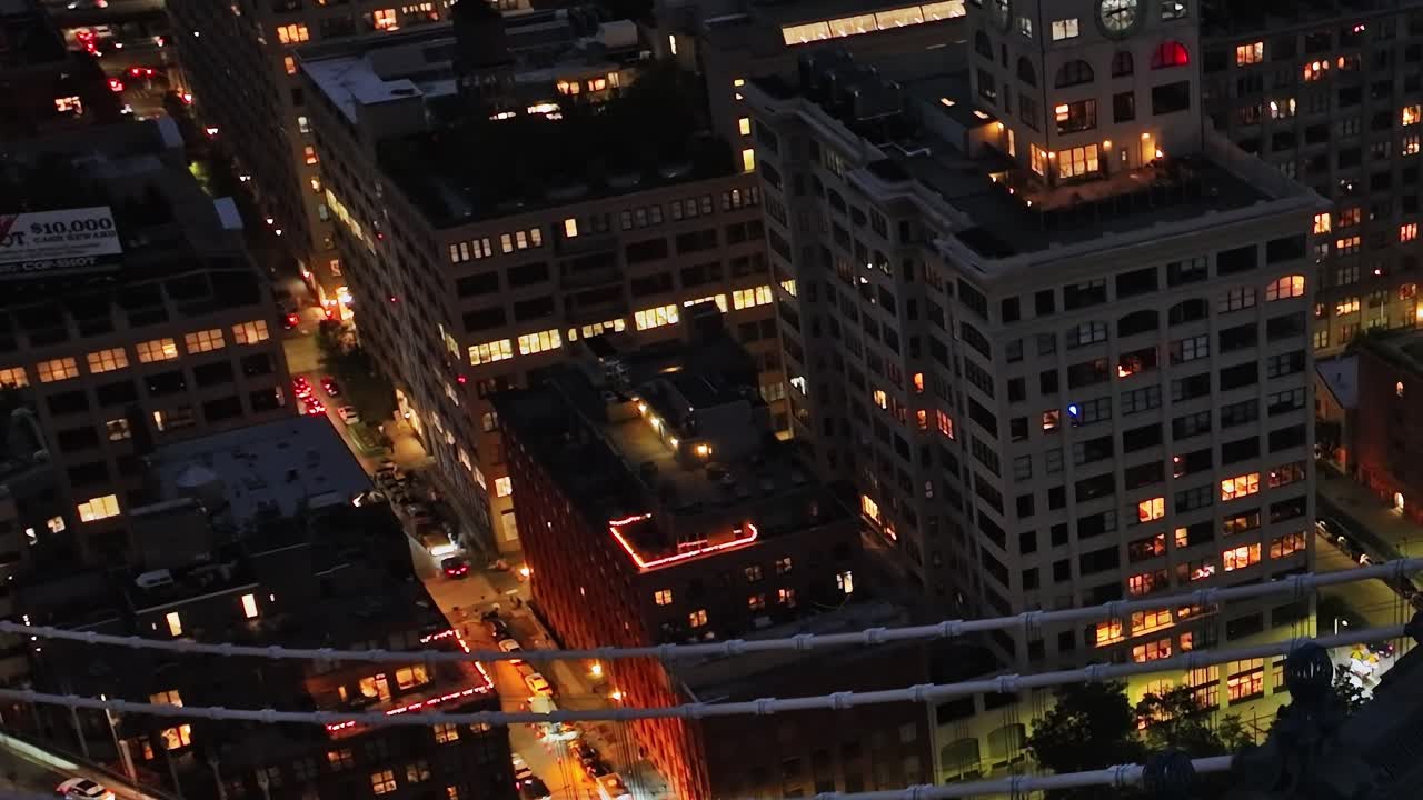 Nighttime aerial view of bustling New York City from a drone