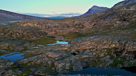 Scenic-View-Of-Curved-Rock-Layers-Of-Hellmobotn-Canyon-In-Northern-Norway