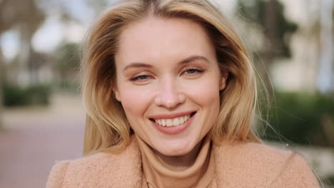 Young-woman-smiling-at-the-camera.