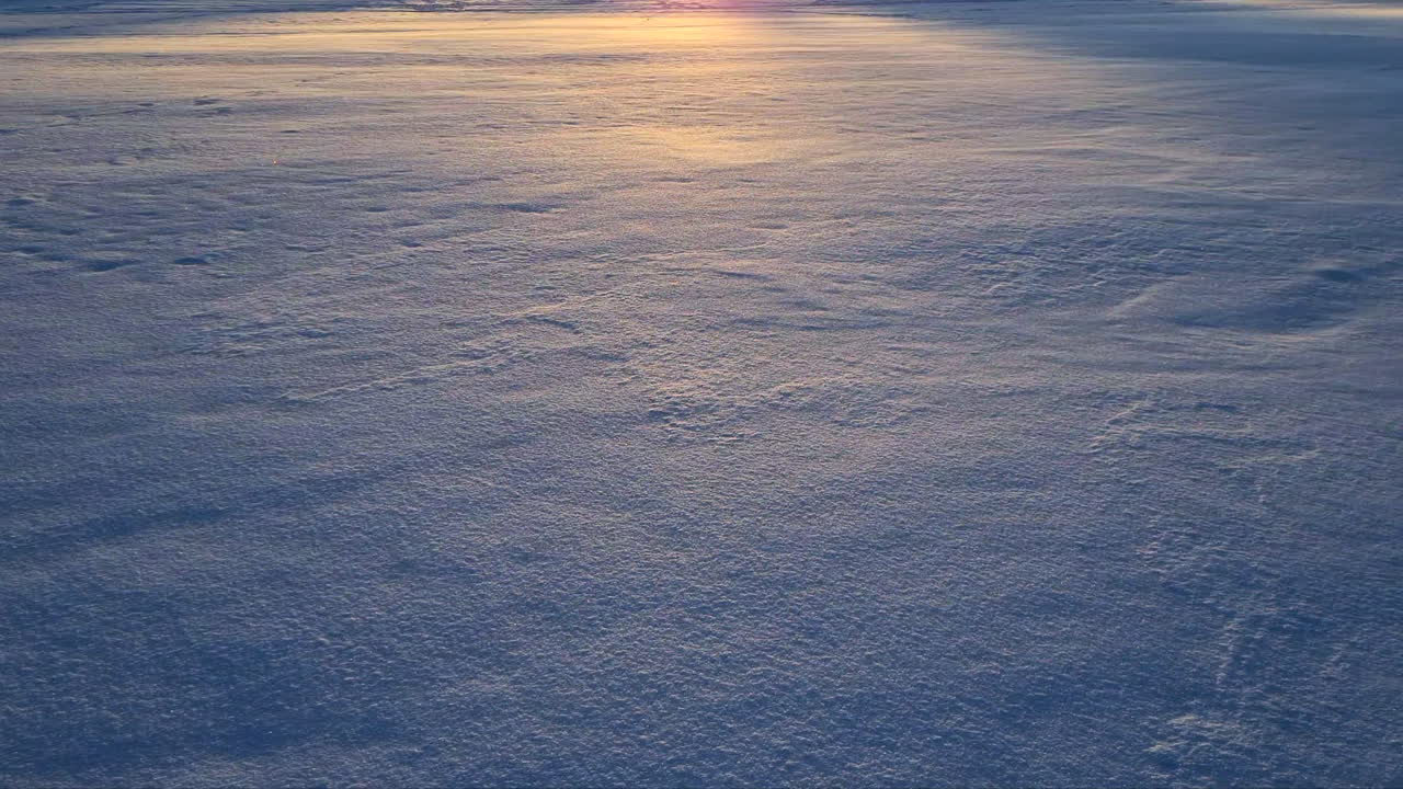 Frozen lake surface at sunset. Static shot