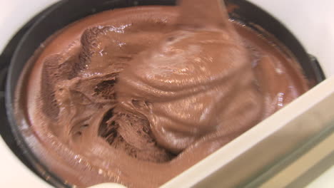 chocolate ice cream being made in a machine