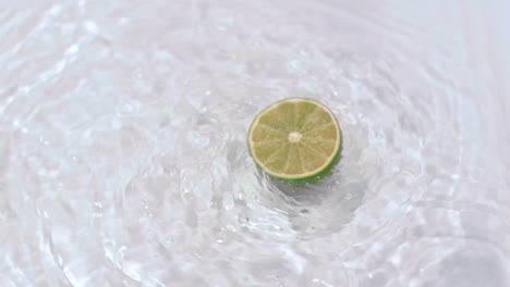 lemon turning in water in super slow motion