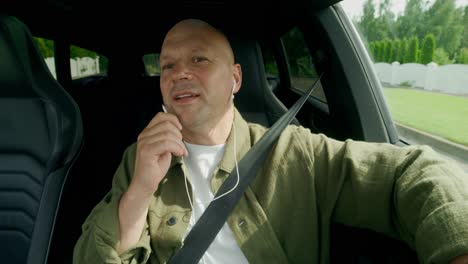 man talking in a car