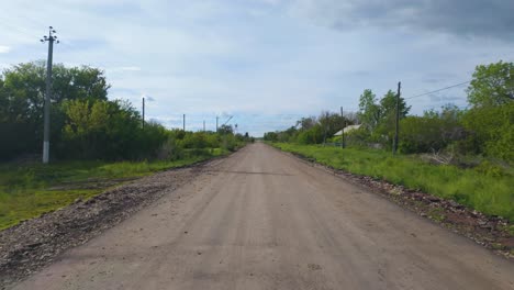 driving along a dirt road in the countryside of kazakhstan, central asia - pov