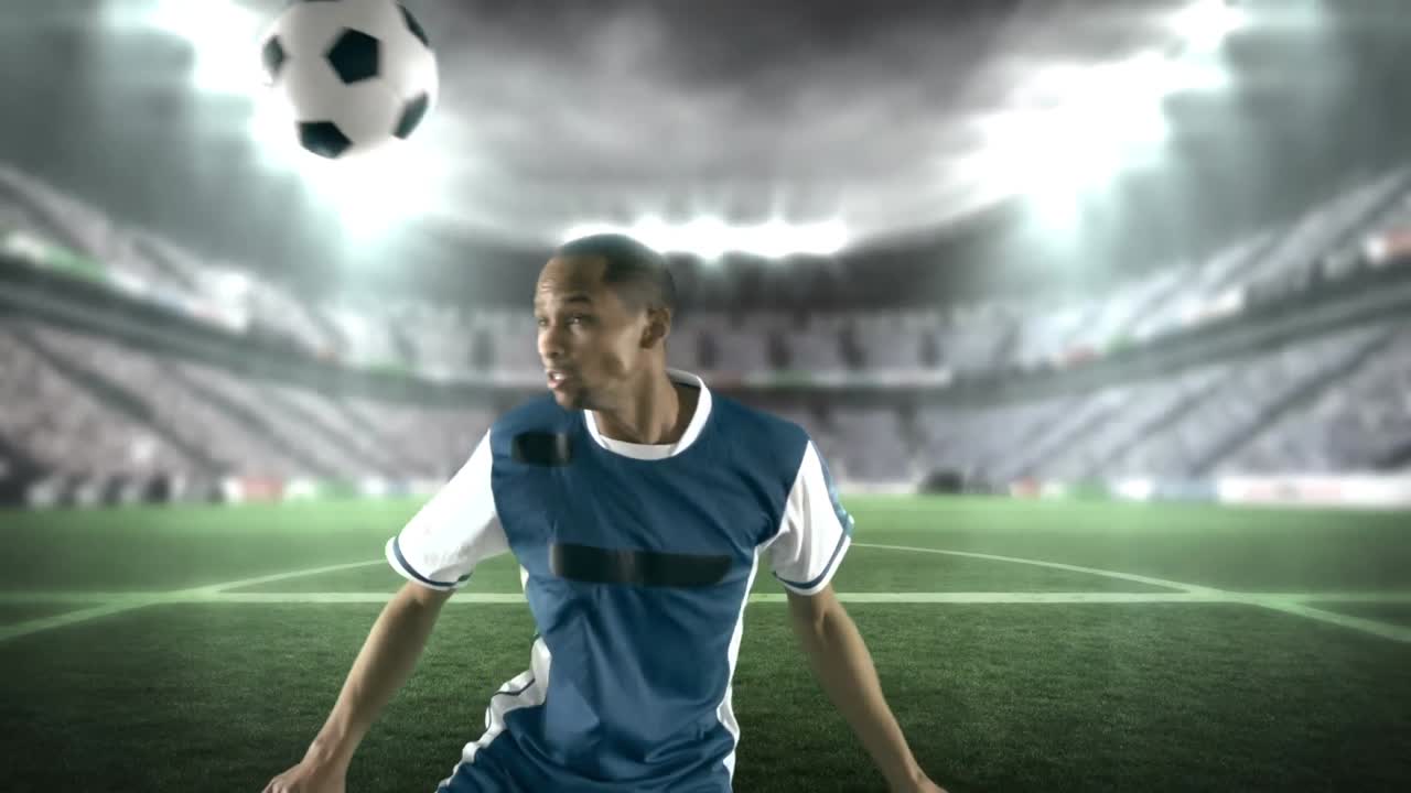 Football player kicking the ball with head